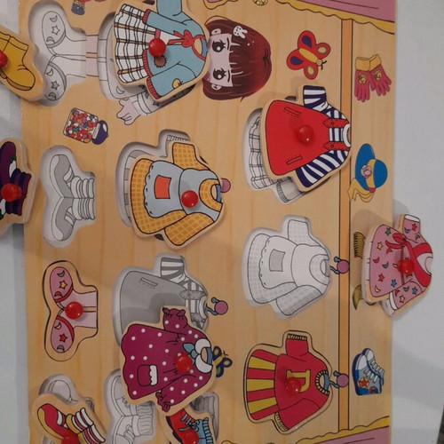 Wooden puzzle girl and bear used with pin board