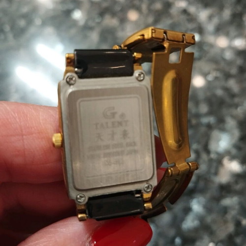Women's wristwatch used, black and gold, 22cm bracelet