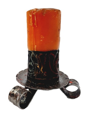 Vintage iron candlestick with used decorative candle