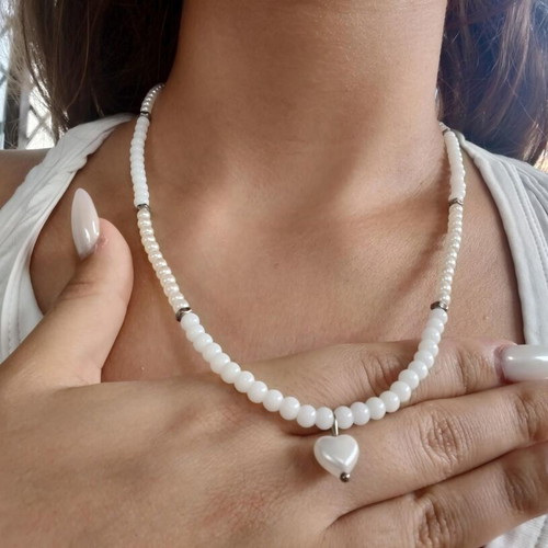 Handmade long pearl necklace with silver details and heart pendant