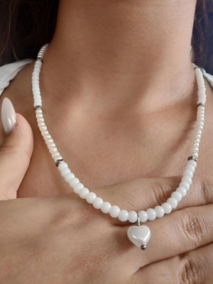 Handmade long pearl necklace with silver details and heart pendant