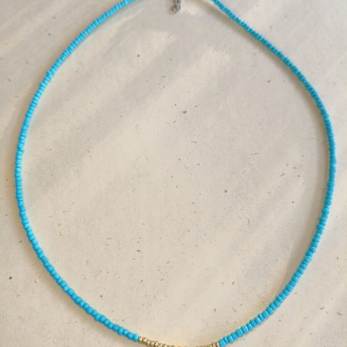 Handmade necklace with gold and blue beads