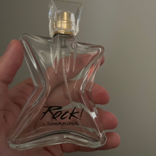 Rock! by Shakira perfume bottle used, empty, star-shaped
