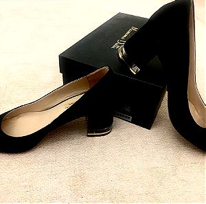 Black suede heels , plexiglass detailed heel.