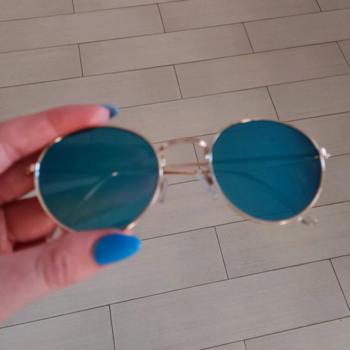 Sunglasses with blue mirror lenses and gold frame