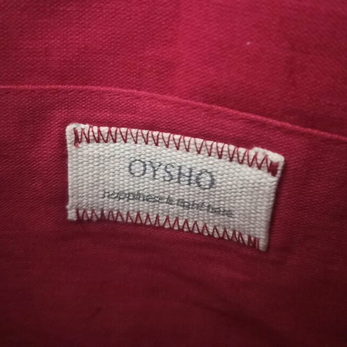 Oysho straw handbag used with boho pom pom design