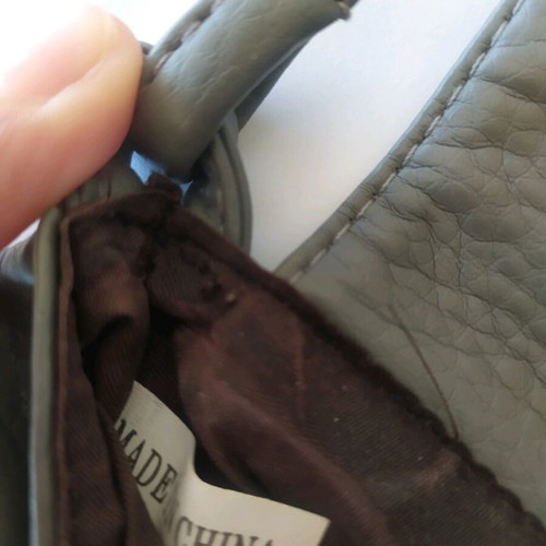 Gray crossbody bag like new with long strap and magnetic closure