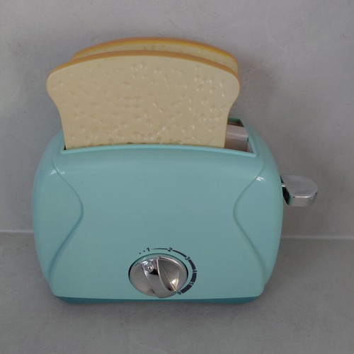 Toy Toaster like new with realistic functions and two fake bread slices
