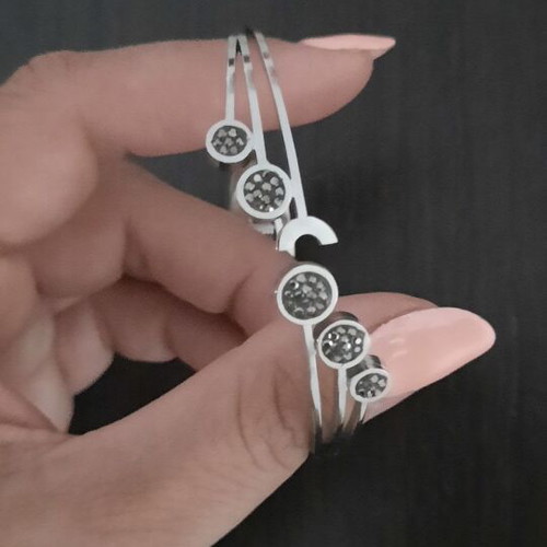 Rigide Stainless Steel bracelet like new with black and grey zirconia circles