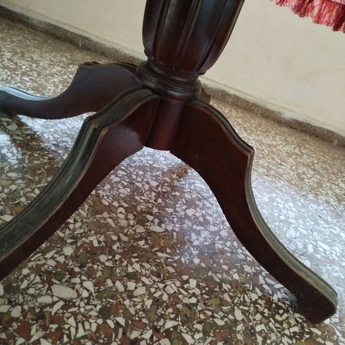 Round table with red tablecloth used, vintage wood design