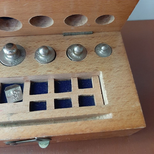 Wooden collectible box with cast iron weights