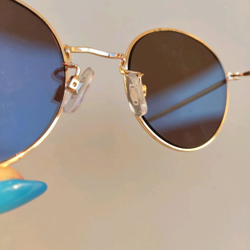 Sunglasses with blue mirror lenses and gold frame