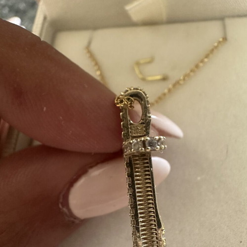 14k gold cross pendant with 9k long chain, reversible design