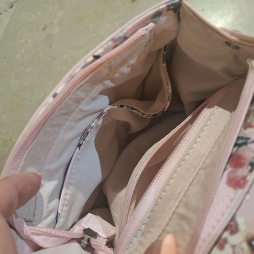 Handbag like new, pink with floral pattern, multiple pockets and strap