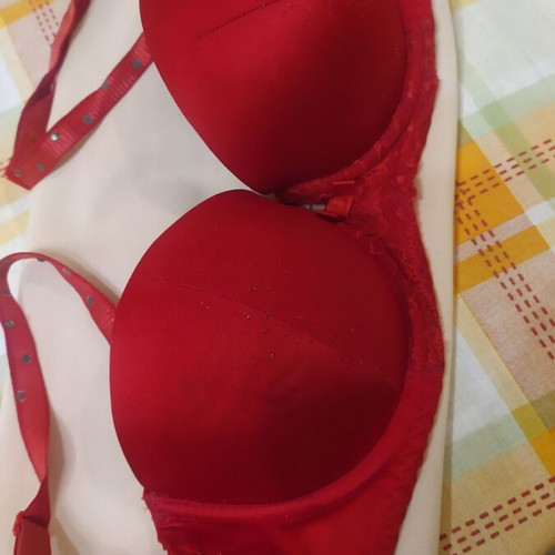 Bra used red with straps decorated with rhinestones