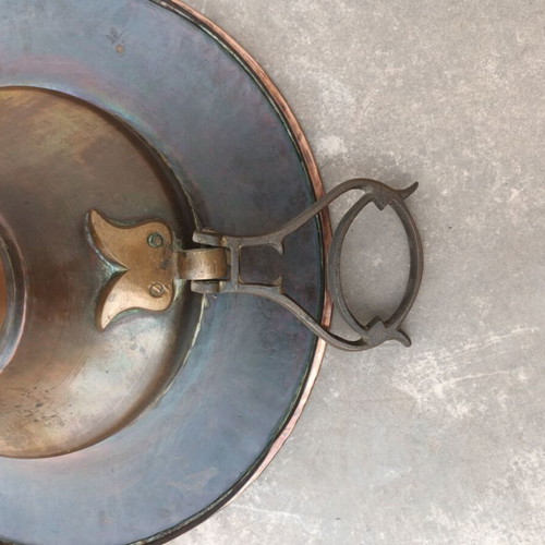 Old copper brazier used with brass handles and decorative bird