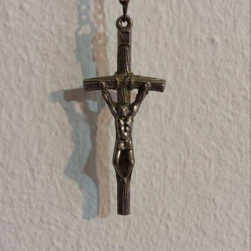 Traditional rosary used, black beads and silver elements