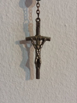 Traditional rosary used, black beads and silver elements