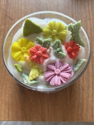 Soy wax scented candle in jar with vanilla aroma
