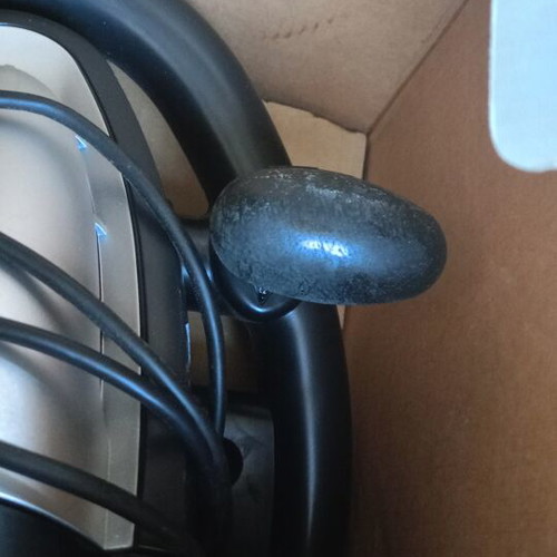 Steering wheel for PlayStation 2 used with signs of wear