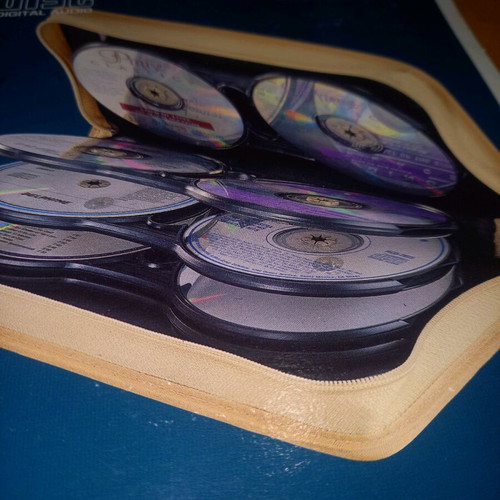 Portable CD-ROM case like new, blue leather, double-sided