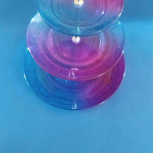 Glass decorative item like new in blue and fuchsia shades