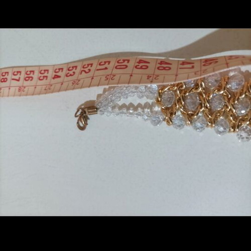 Women's evening necklace like new with gold weave and white stones