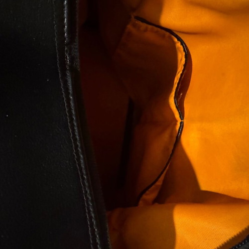 Leather backpack like new, black with orange lining