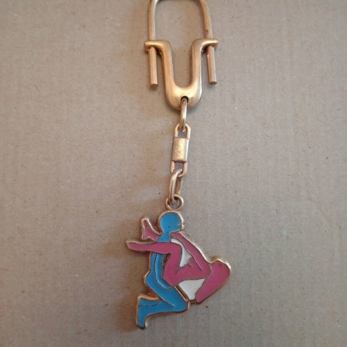 Metal keychain with erotic scene, like new, blue
