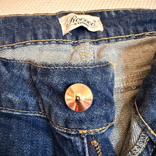 Vintage blue Rococo jeans with studs and rips like new