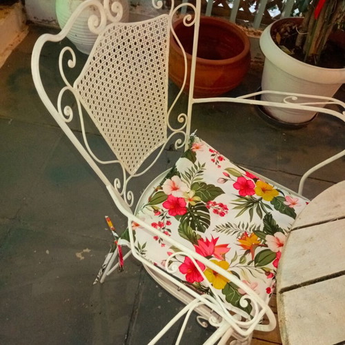 Wrought iron chairs set with round wooden table, vintage