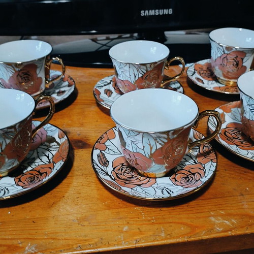 Tea and coffee set new with gold trim and rose design