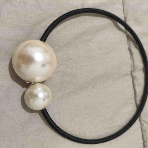 Choker necklace with two asymmetrical pearls used, black elastic band