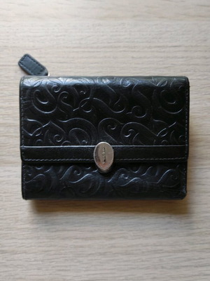 Leather wallet used, black embossed with silver detail