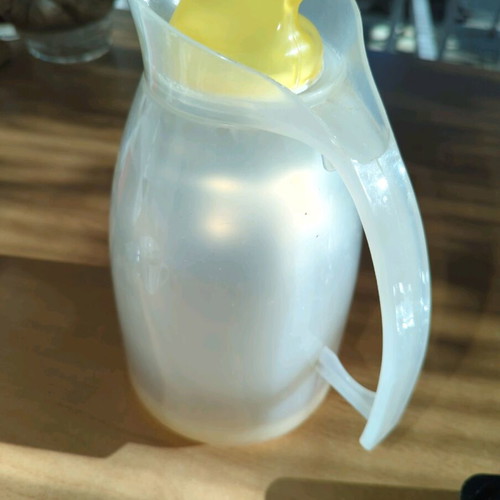 Household thermos like new, milky plastic with orange, glass interior