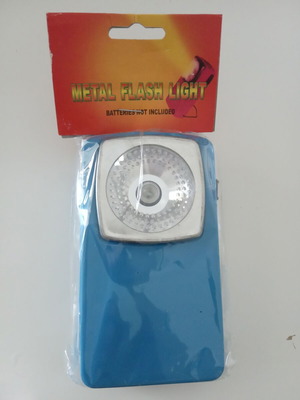 Vintage flashlight new in packaging, accepts flat battery