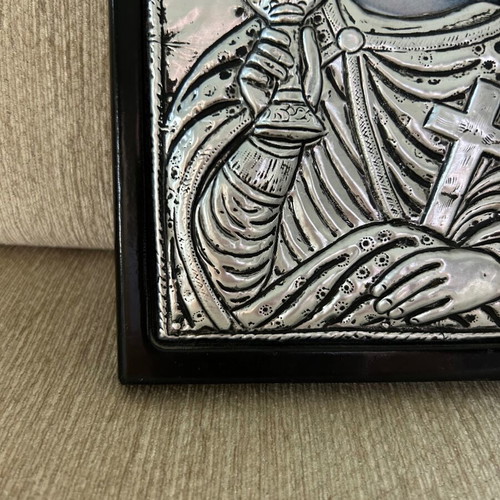 Religious icon used with metal overlay on wooden base