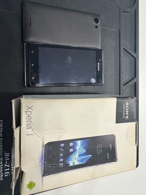Sony Xperia J used with charging port issue, no charger included