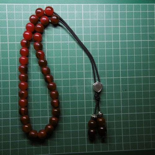 Handmade komboloi with 33+4 acrylic beads and silver shield