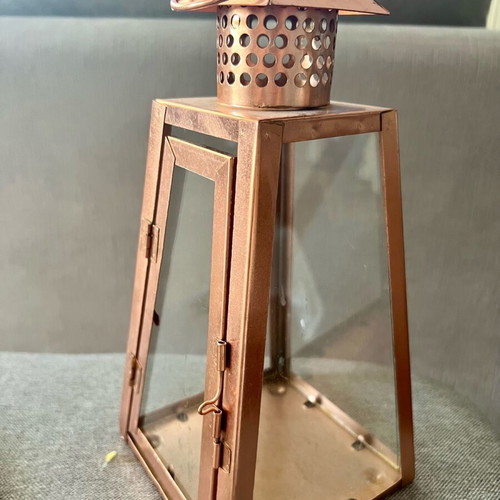 Metal candle lantern used, copper color