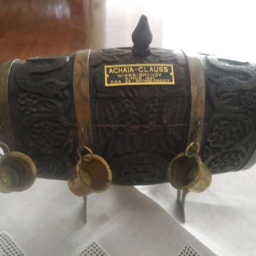 Antique barrel used with brass cups and carvings
