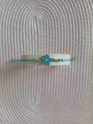 Turquoise Bracelet with Floral Bead and Adjustable Weave like new