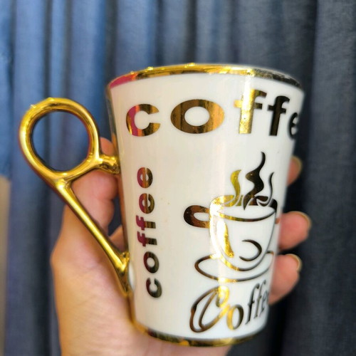 porcelain mug with gold inscriptions