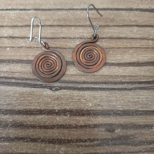 Metal earrings with spiral design like new