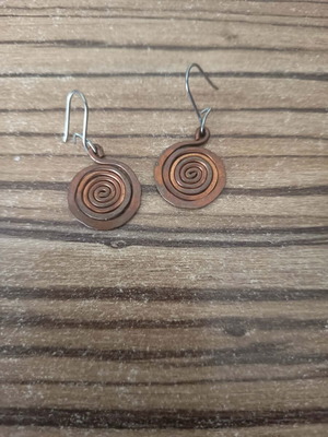 Metal earrings with spiral design like new