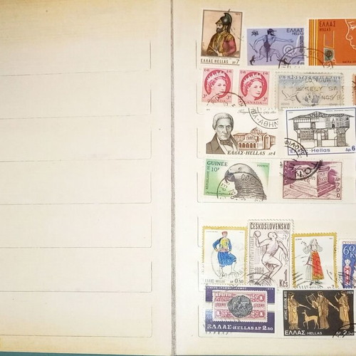 Book with collection of various Greek and foreign stamps used