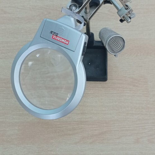 Magnifying glass with modeling accessories like new