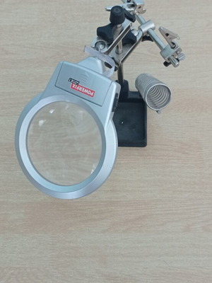 Magnifying glass with modeling accessories like new