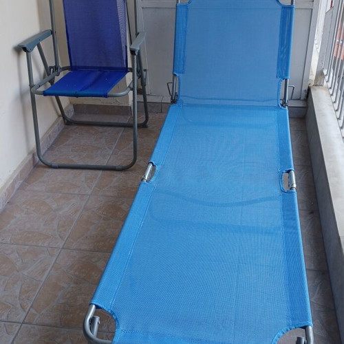 New beach lounger with used chair