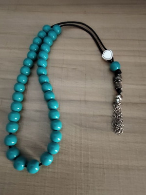 Handmade worry beads with acrylic beads, silver shield and metal tassel